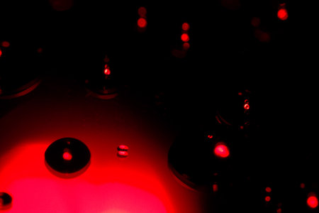 Abstract red bokeh light on black background. Close-up.の写真素材