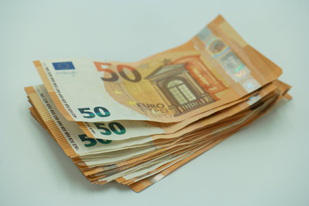 Euro banknotes on a white background. Shallow depth of field.