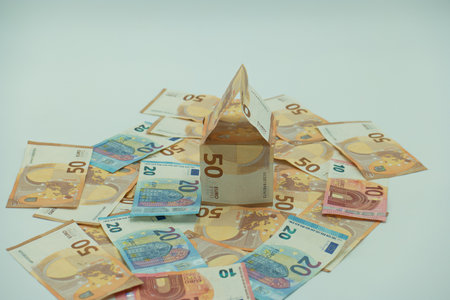 Paper house made of euro banknotes. The concept of buying real estate.の写真素材