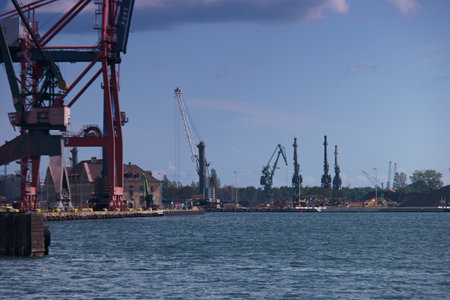 Cargo terminal for loading bulk cargo of iron ore by ship cranes and grabs.の写真素材