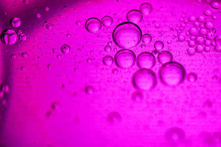 Bubbles on a pink background close-up. Macro photography.の写真素材