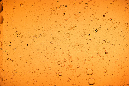 Drops of water on the glass. Orange background. Shallow DOF.の写真素材