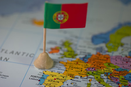 Portugal flag on the map. Selective focus. Travel concept.