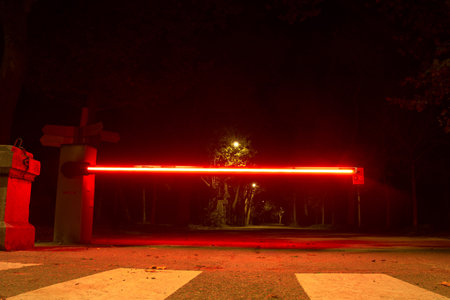 Red light in the park at night with dark background, Thailand.の写真素材