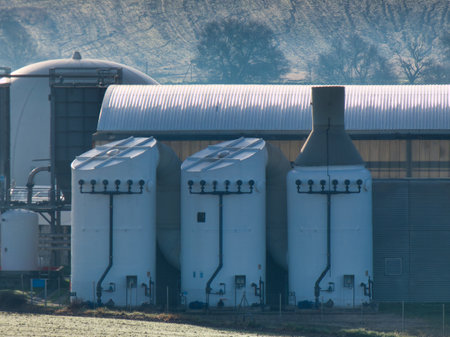 Outdoor metal gas tanks at a sewage treatment plant in a rowの写真素材