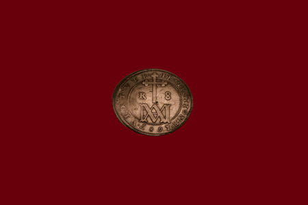 An ancient coin, a former means of payment made of metalの写真素材