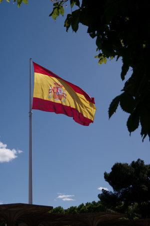 Spain flag fluttering in the wind, the biggest flag in Madridの写真素材