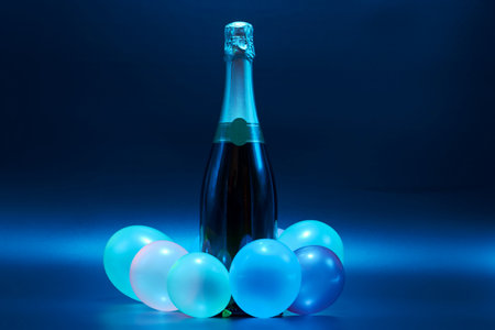 new year or special occasion champagne isolated on colorful shiny backgroundの写真素材