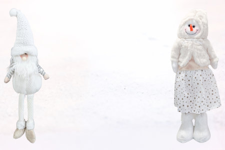 festive christmas toys on a white snowy backgroundの写真素材