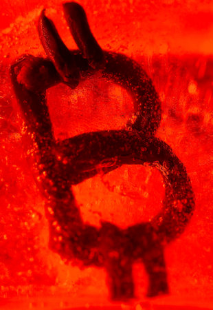 bitcoin currency symbol frozen in iceの写真素材