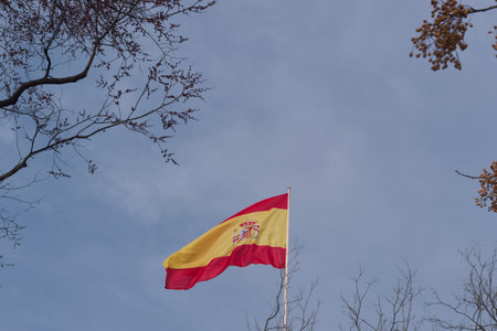Spanish flag flying against the sky