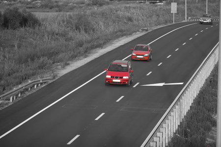 red car on the highway in black and whiteの写真素材
