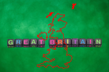 Colorful blocks arranged to form the words Great Britain are set against a bright green background, featuring the outline of the British Isles prominently.の写真素材