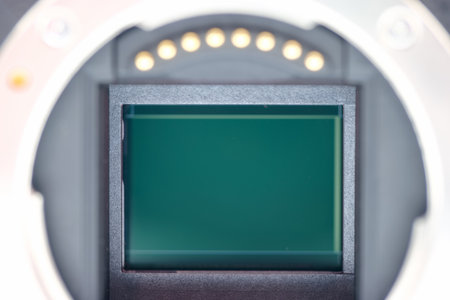 Close up shows the interior of a camera with a sensor at its center, designed for capturing light.の写真素材