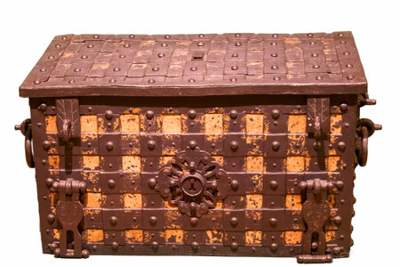This decorative vintage trunk features a unique pattern with rusted metal elements and a prominent locking mechanism. Its craftsmanship reflects historical design aesthetics.の写真素材