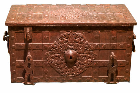 An antique metal chest features detailed craftsmanship with ornate patterns and a keyhole. The chest...