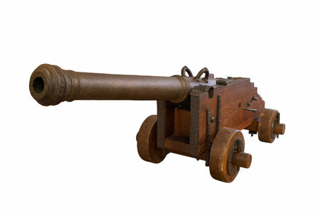 A wooden cannon stands prominently in a museum, illustrating historical military technology. It reveals craftsmanship and design from earlier eras, attracting visitors' curiosity and admiration.の写真素材