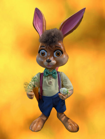 A rabbit figure stands with a carrot in one hand and a decorated egg in the other. The backdrop...