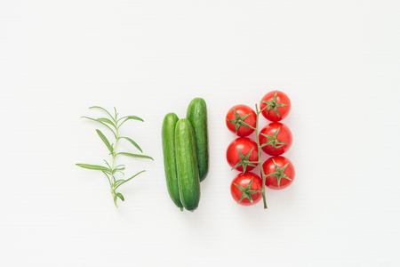 Isolated fresh ingredients for delicious salad on white background, top view mockupの写真素材