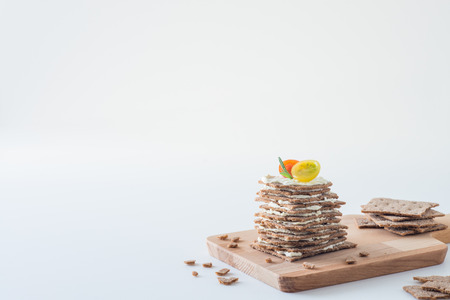 Rye crispy bread (Swedish crackers) stacked in the form of cake in layers with soft cheese, cherry...