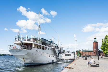 STOCKHOLM, SWEDEN - JULY 18, 2017: View over Lady Hutton ship with City Hall in the background, on sunny summer day in Stockholm, Swedenのeditorial素材