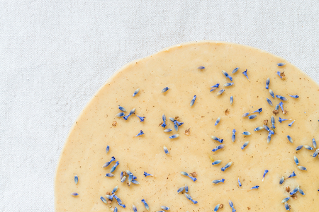 Raw healthy cake with lavender flowers. Top view, copy spaceの写真素材