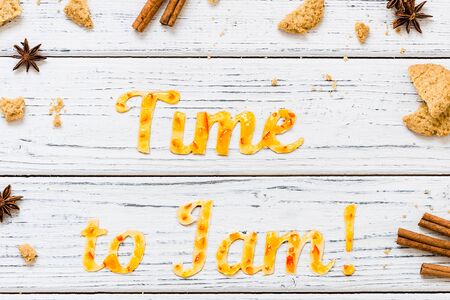 Food typography Time to Jam on white wooden rustic background. Orange jam lettering with cookies,...
