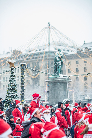 STOCKHOLM, SWEDEN â DECEMBER 11, 2016: People dressed up as santas participate in charity event Stockholm Santa Run in Swedenのeditorial素材