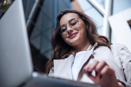 Copy-spaced image of an elegant young woman with a laptop in handsの写真素材