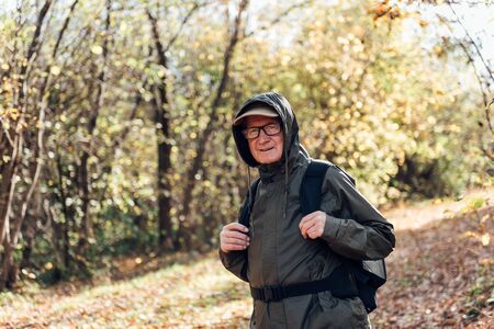 Senior man hiking on a mountain.