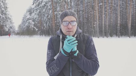 a freezing and frosty guy in the parkの写真素材