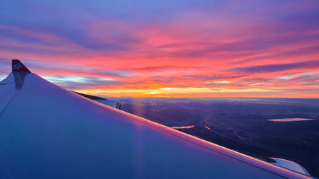 View from the window of an airplane during a flight at sunset.の写真素材