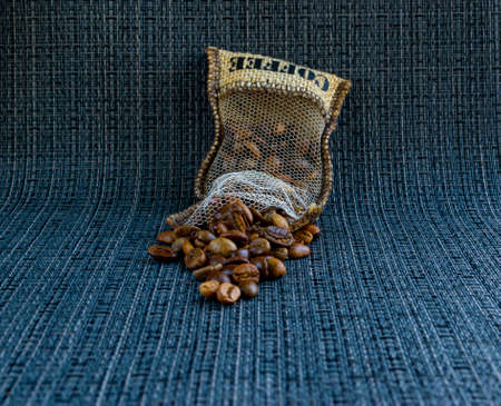 Coffee beans spilled out of the bag.の写真素材