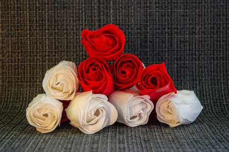 Red and white roses on a gray background.の写真素材
