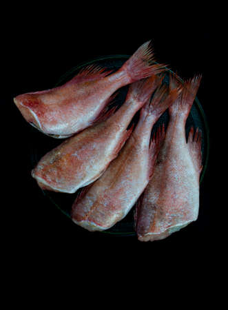 The cleaned sea bass is laid out on a platter.の写真素材