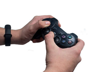 Two hands hold a black game joystick on a white background.
