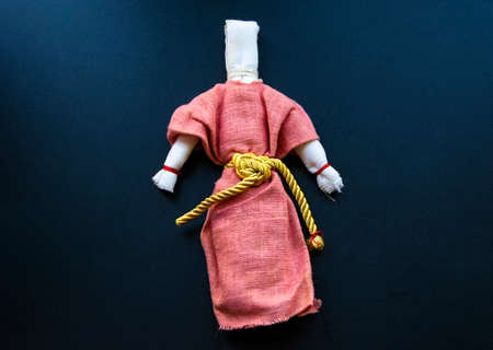 Rag doll on a black background