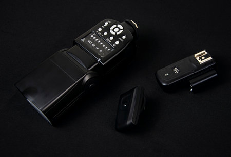 Photo flash and synchronizers on a black background.