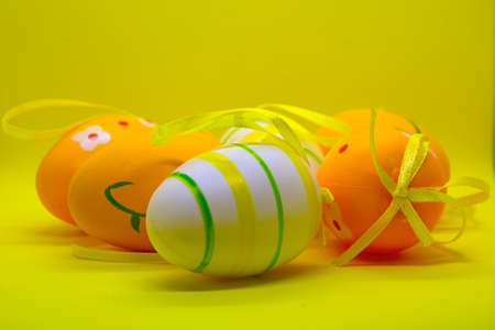 Painted eggs with a yellow bow.
