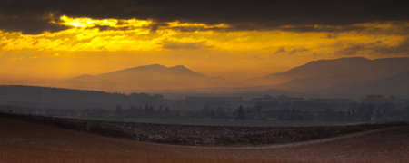 Sunset over foggy cityの写真素材