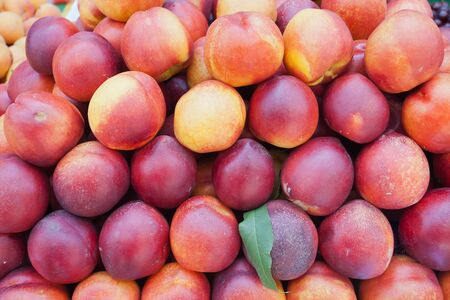 Image of many of fresh peaches, made in the market for sale の写真素材