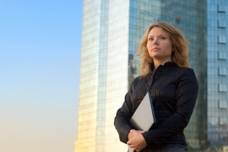 Young businesswomen holding laptopの写真素材