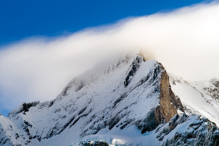 Summit of jungfrau - top of Europe in Grindelwald ski area. Switzerland. There are a blue sky and cloudsの写真素材