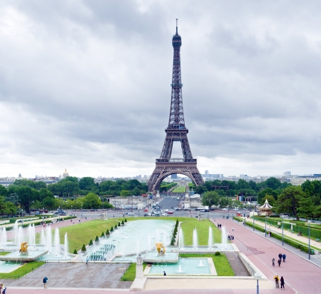 Day image of the main tower in Paris - Tower Effel. Against the backdrop of a huge tower near everything seems to be very tiny, only clouds have the same power at altitude.のeditorial素材