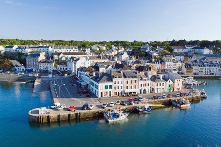 The image of the marina with the yachts with the main street of La Palais, Belle Ile en Mer  France のeditorial素材
