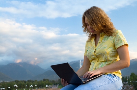 Young businessman working on laptop  Its his internet business, through wireless technologyの写真素材