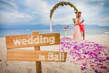 wedding couple just married near the beach at Baliの写真素材