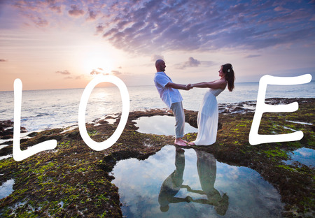 wedding couple just married near the beach with love textの写真素材