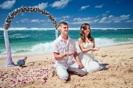 wedding couple just married near the beach at Baliの写真素材