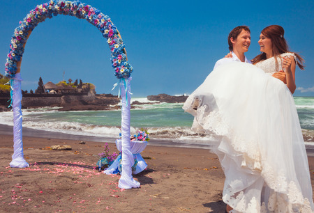 wedding couple just married near the beach at Baliの写真素材